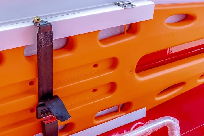 Spine board stored upright in the S6 Ambulance patient cabin